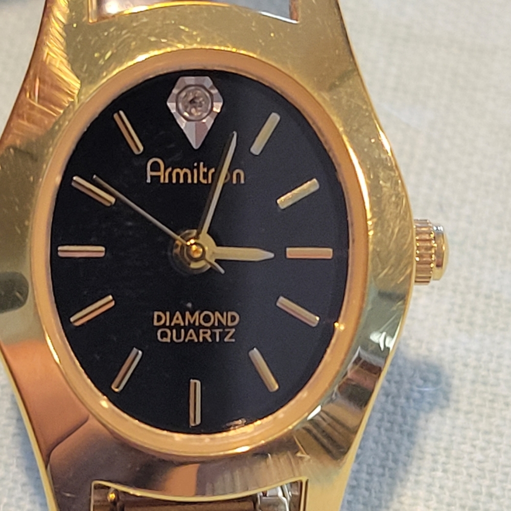 Vintage,Armitron Gold-Tone Bracelet Watch with Black Dial and Diamond Accent.